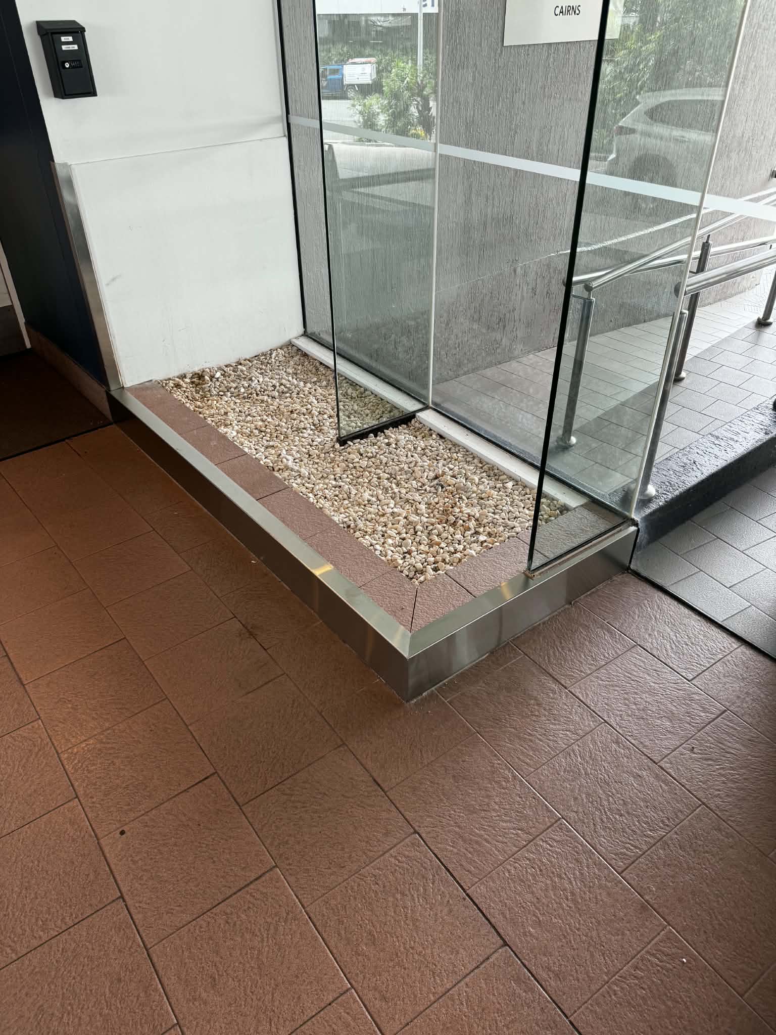 Glass and metal entry partition